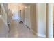 Spacious entryway with tile floors and coat rack at 904 Assembly Ct, Reunion, FL 34747