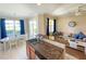Open kitchen features granite countertops, stainless steel appliances, and breakfast bar at 904 Assembly Ct, Reunion, FL 34747