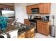 Kitchen boasts granite countertops and stainless steel appliances at 904 Assembly Ct, Reunion, FL 34747