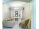 Home office features a desk, comfortable seating, and a chandelier at 904 Assembly Ct, Reunion, FL 34747