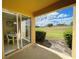 Private patio with sliding glass doors and golf course view at 904 Assembly Ct, Reunion, FL 34747