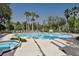 Community pool and hot tub with lounge chairs at 904 Assembly Ct, Reunion, FL 34747