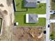 An aerial view of a house and its surrounding landscape at 905 Desmoines Way, Poinciana, FL 34759