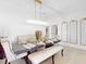 Dining room with chandelier, bench seating, and wall art at 905 Desmoines Way, Poinciana, FL 34759