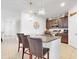 Island kitchen with granite countertops and modern fixtures at 905 Desmoines Way, Poinciana, FL 34759