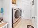 Convenient laundry room with washer, dryer, and shelving at 905 Desmoines Way, Poinciana, FL 34759
