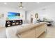 Bright living room features a large TV, comfy seating, and dining area at 905 Desmoines Way, Poinciana, FL 34759
