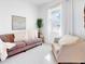 Living room with couch, chair, large mirror, and natural light at 905 Desmoines Way, Poinciana, FL 34759
