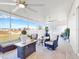 Relaxing screened porch with seating and ceiling fans at 905 Desmoines Way, Poinciana, FL 34759