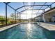 Inviting pool area with screened enclosure, patio, and outdoor kitchen at 939 Braewood Dr, Clermont, FL 34715