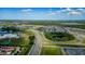 Aerial view showing community, roads, and school at 10415 Austrina Oak Loop, Winter Garden, FL 34787