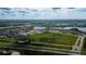 Aerial view of community near highway and lake at 10415 Austrina Oak Loop, Winter Garden, FL 34787