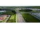 Community overview showing homes, roads, and green spaces at 10415 Austrina Oak Loop, Winter Garden, FL 34787