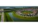 Aerial view of a community with houses, lakes, and roads at 10415 Austrina Oak Loop, Winter Garden, FL 34787
