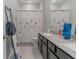 Clean bathroom with double vanity and shower/tub combo at 10415 Austrina Oak Loop, Winter Garden, FL 34787