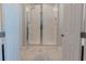 Clean bathroom with a large shower and tile flooring at 10415 Austrina Oak Loop, Winter Garden, FL 34787