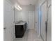 Bathroom with granite countertop and double sinks at 10415 Austrina Oak Loop, Winter Garden, FL 34787