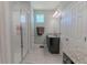 Main bathroom with walk-in shower and granite vanity at 10415 Austrina Oak Loop, Winter Garden, FL 34787