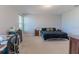 Bright bedroom with large bed and window at 10415 Austrina Oak Loop, Winter Garden, FL 34787