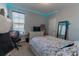 Bedroom with a bed, desk, and decorative lighting at 10415 Austrina Oak Loop, Winter Garden, FL 34787