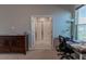 Spacious bedroom with large windows and room for a home office at 10415 Austrina Oak Loop, Winter Garden, FL 34787