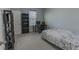 Bright bedroom with a double bed, desk, and built-in shelving at 10415 Austrina Oak Loop, Winter Garden, FL 34787