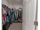 Large walk-in closet with ample shelving and hanging space at 10415 Austrina Oak Loop, Winter Garden, FL 34787