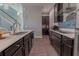Modern kitchen with dark cabinets, stainless steel appliances, and a large island at 10415 Austrina Oak Loop, Winter Garden, FL 34787