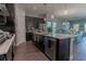 Spacious kitchen with island, stainless steel appliances, and dark cabinetry at 10415 Austrina Oak Loop, Winter Garden, FL 34787
