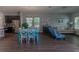 Open floor plan with kitchen island, dining table, and living area at 10415 Austrina Oak Loop, Winter Garden, FL 34787