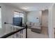 Spacious loft area features a comfortable couch and built-in shelving at 10415 Austrina Oak Loop, Winter Garden, FL 34787
