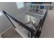 Elegant staircase with dark wood railings connecting floors at 10415 Austrina Oak Loop, Winter Garden, FL 34787