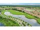 Golf course and community overview with lake and road at 1066 Quaker Ridge Ln, Davenport, FL 33896