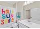 Bathroom with shower/tub combo and cheerful decor at 1066 Quaker Ridge Ln, Davenport, FL 33896