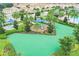 Playground with slides, fitness equipment, and shaded seating areas at 1066 Quaker Ridge Ln, Davenport, FL 33896