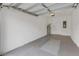 Clean and spacious garage with painted floor and extra storage space at 1066 Quaker Ridge Ln, Davenport, FL 33896