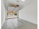 Garage with open door, offering a view of the community at 1066 Quaker Ridge Ln, Davenport, FL 33896