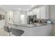 Modern kitchen with white cabinets and gray countertops at 1066 Quaker Ridge Ln, Davenport, FL 33896