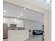 Modern kitchen with white cabinets and a breakfast bar at 1066 Quaker Ridge Ln, Davenport, FL 33896