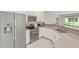 Modern kitchen with stainless steel appliances and an island at 1066 Quaker Ridge Ln, Davenport, FL 33896