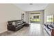 Living room with sliding glass doors leading to a patio at 1066 Quaker Ridge Ln, Davenport, FL 33896