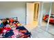 Bedroom with anime bedding and mirrored closet doors at 1504 Hummingbird Ln, Lakeland, FL 33801