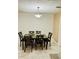 Dining room with dark wood table and six chairs at 1504 Hummingbird Ln, Lakeland, FL 33801