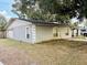 Ranch style home with mature landscaping and attached garage at 1504 Hummingbird Ln, Lakeland, FL 33801