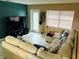 Living room with sectional sofa and large flat screen TV at 1504 Hummingbird Ln, Lakeland, FL 33801