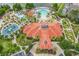Community clubhouse with pool, sports court, and lush landscaping at 160 Hideaway Beach Ln, Kissimmee, FL 34746
