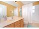 Bathroom with tub, shower, toilet and sink at 160 Hideaway Beach Ln, Kissimmee, FL 34746