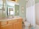 Bright bathroom with light wood vanity, toilet, and shower/tub combo at 160 Hideaway Beach Ln, Kissimmee, FL 34746