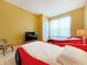 Bedroom with two red car beds and a TV at 160 Hideaway Beach Ln, Kissimmee, FL 34746