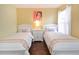 Two twin beds with white frame and coastal decor at 160 Hideaway Beach Ln, Kissimmee, FL 34746